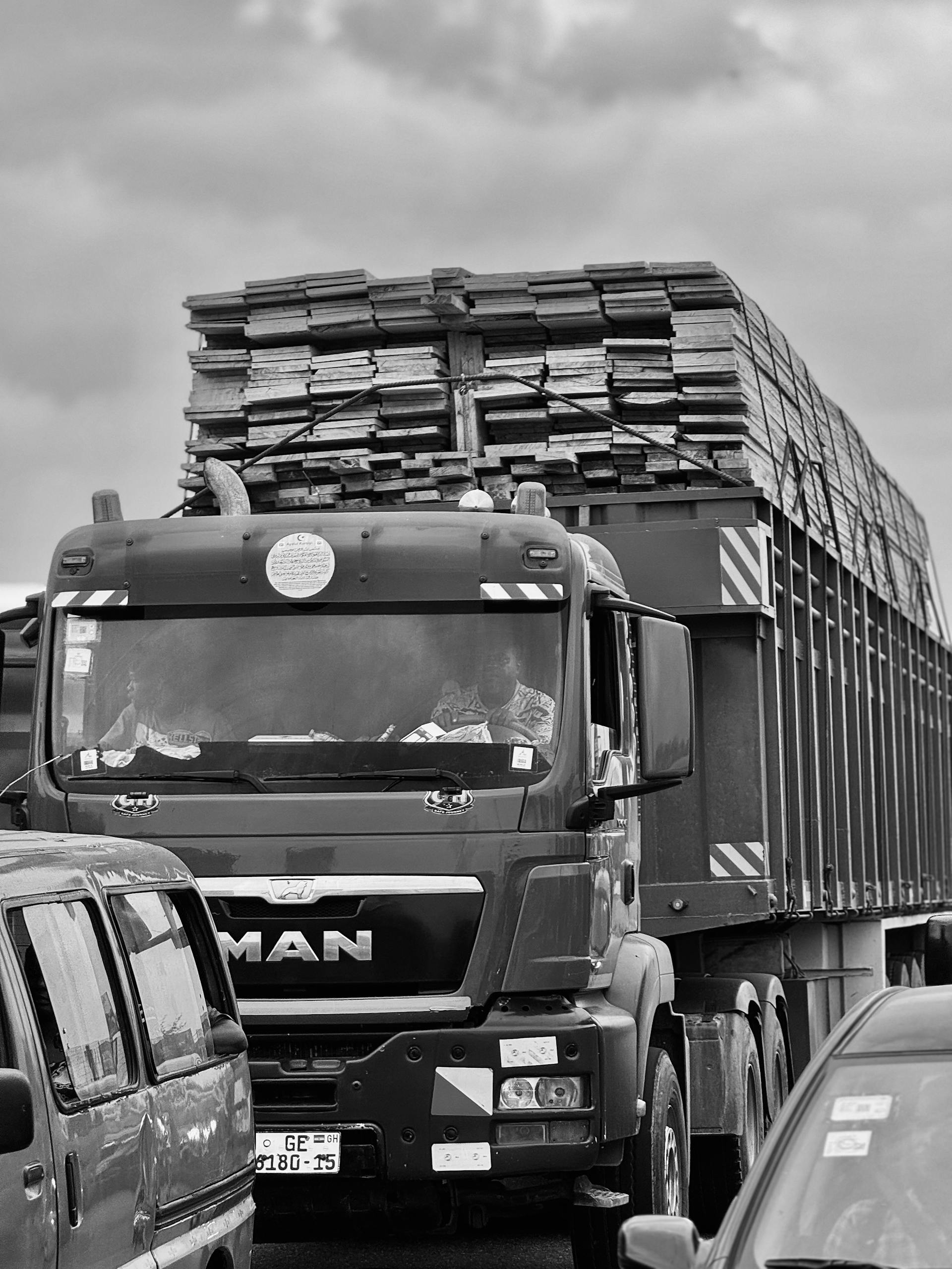 Heavy traffic scene with a loaded truck in Lapaz, Greater Accra Region, Ghana.